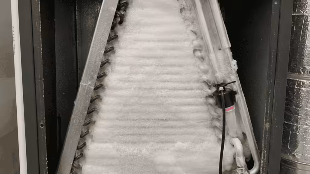 Frozen evap coil in an HVAC unit that's causing it to run but not cool